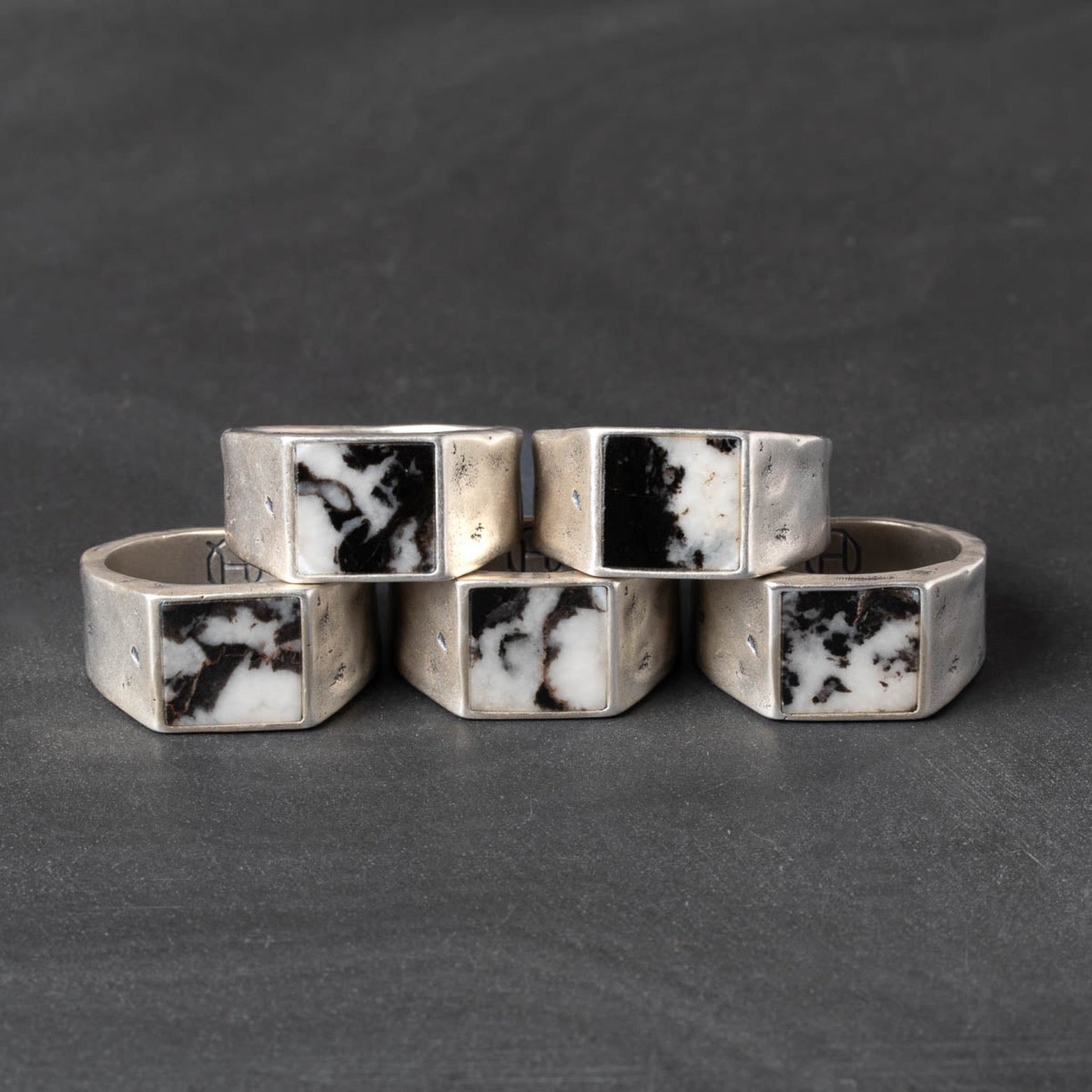 Five rings made of rugged silver and zebra jasper 