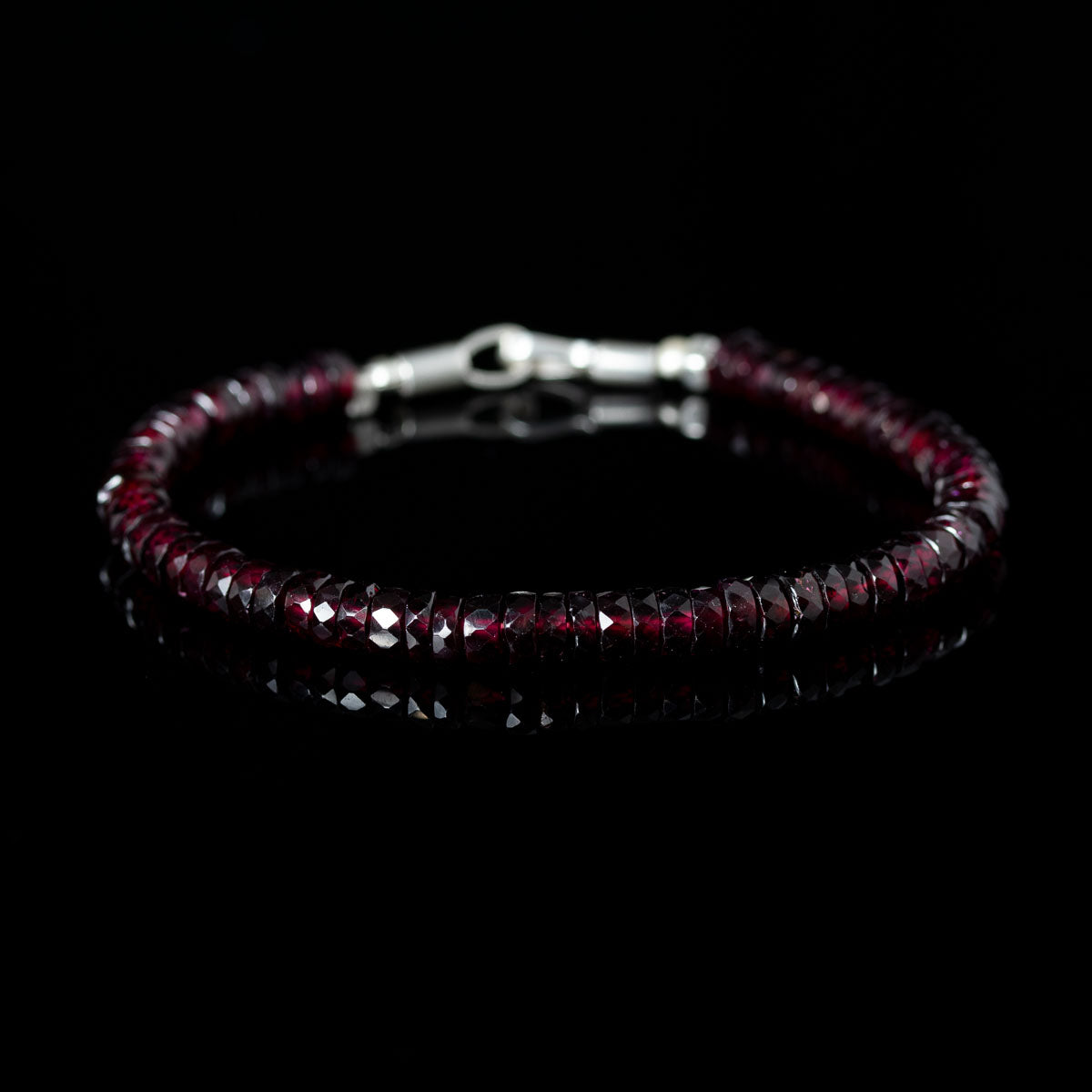 Beaded bracelet with dark red garnet beads
