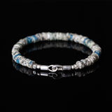 White and blue beaded bracelet with sterling silver clasp