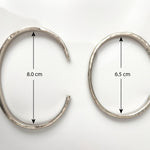 Two Silver Cuffs on a white background