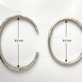 Two Silver Cuffs on a white background