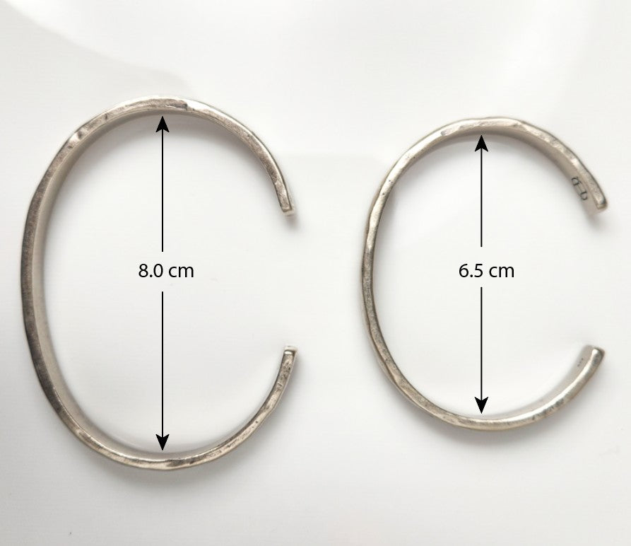 Two Silver Cuffs on a white background