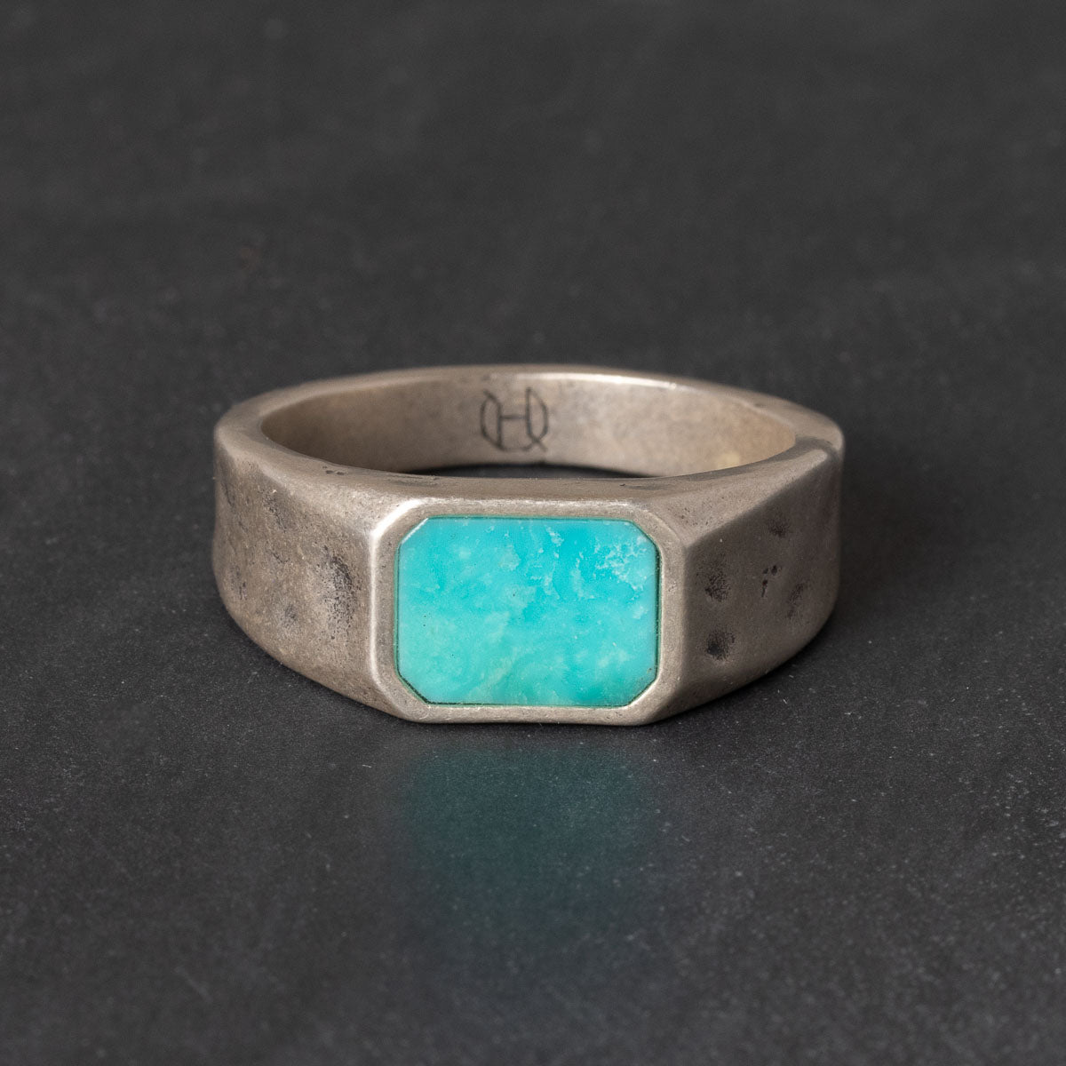 Quinn Henry sterling silver signet ring with natural turquoise inlay and rugged textured finish.