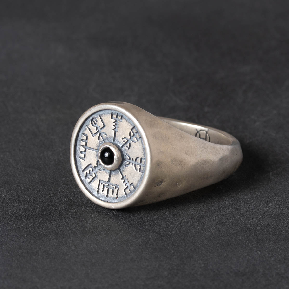 Silver signet ring with a vegvisir design and black onyx stone