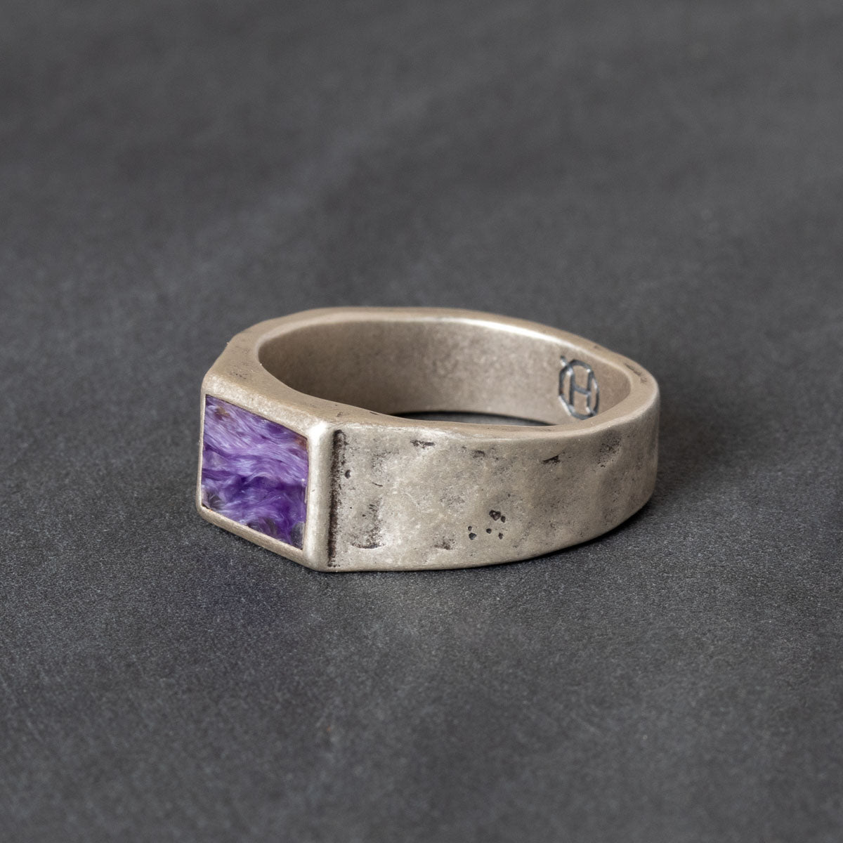 Quinn Henry silver signet ring with Charolite stone inlay on gray background