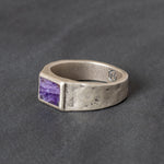 Quinn Henry silver signet ring with Charolite stone inlay on gray background