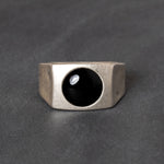 Sterling silver ring with black onyx cabochon center stone
