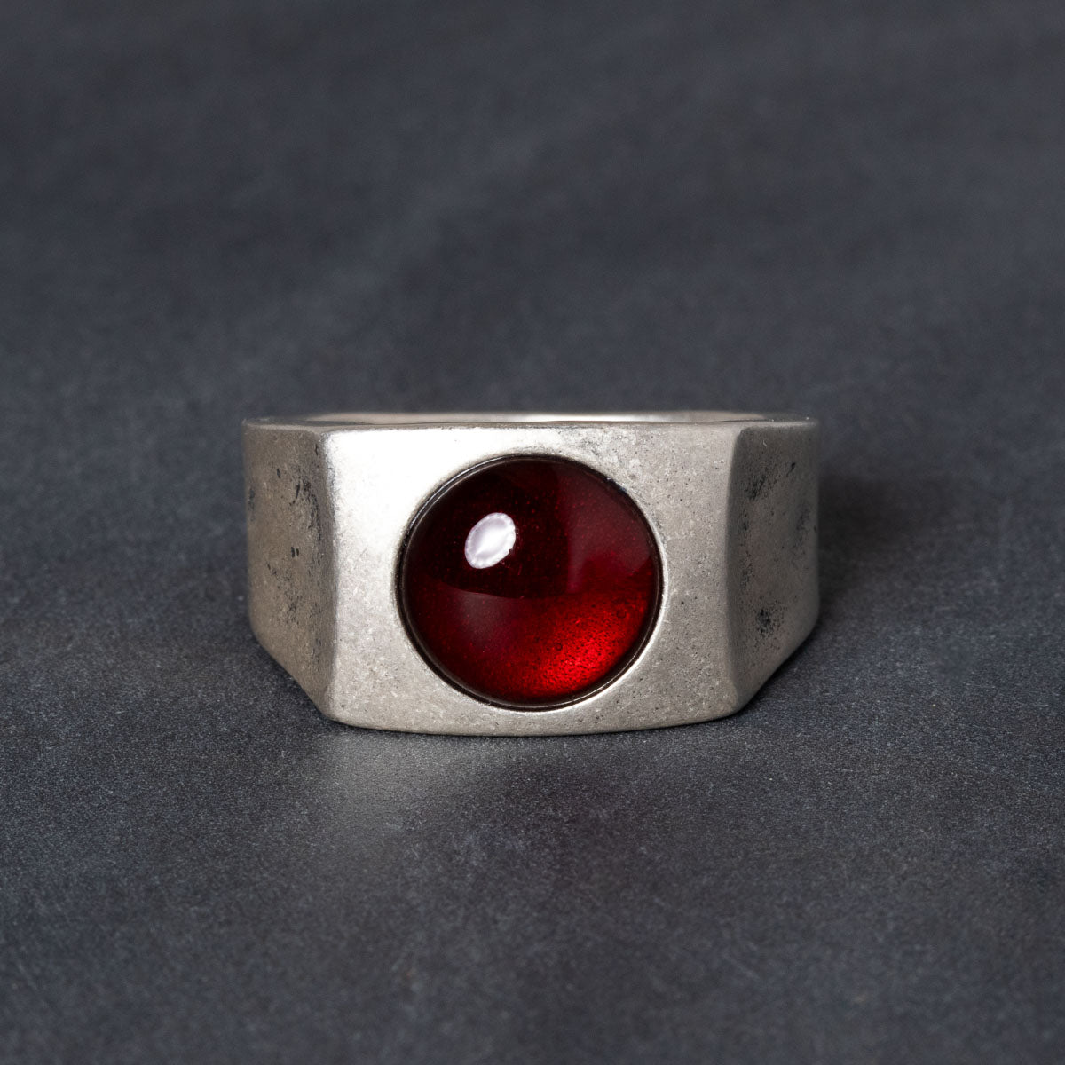 Sterling silver signet ring with red garnet centerstone