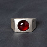 Sterling silver signet ring with red garnet centerstone