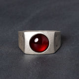 Sterling silver signet ring with red garnet centerstone