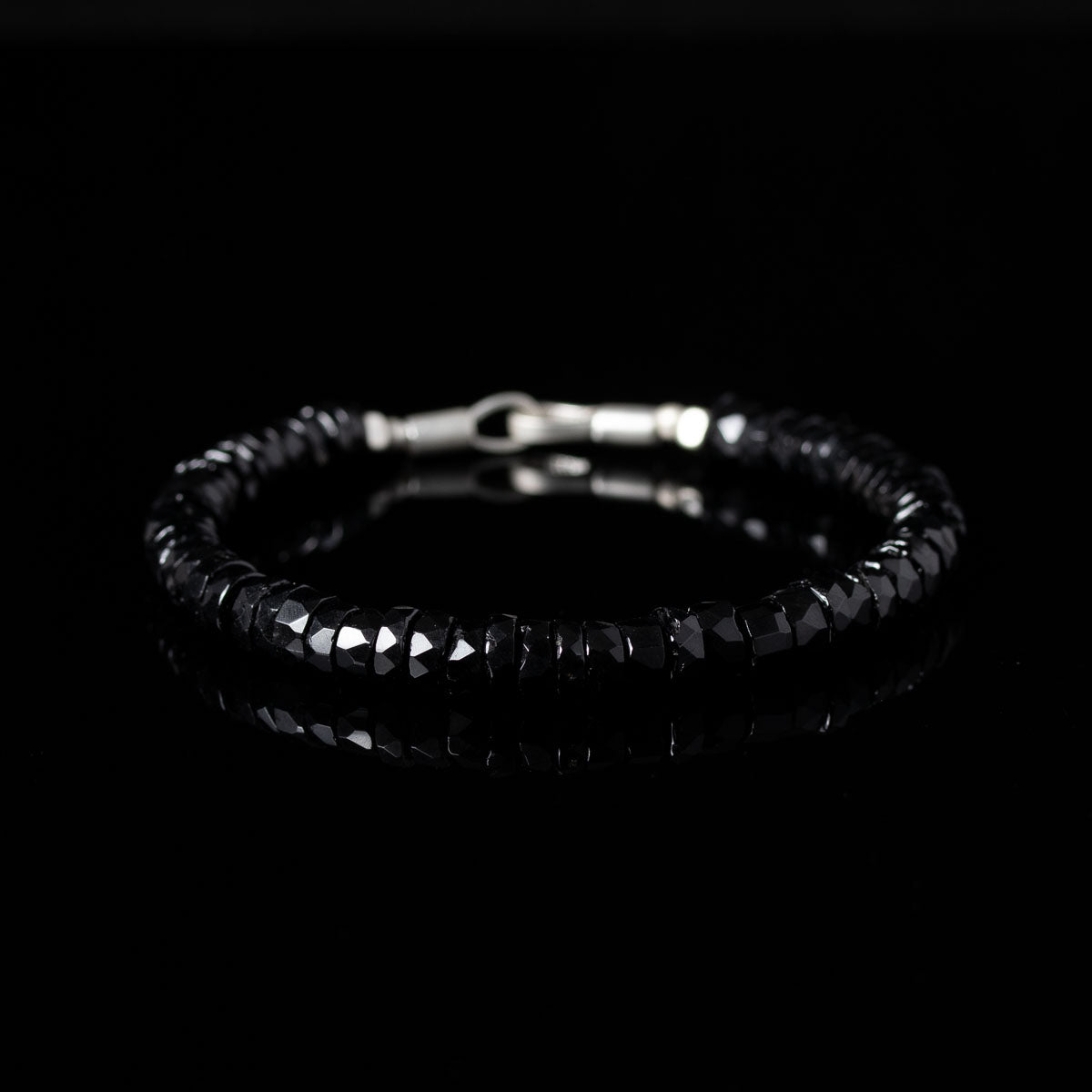 Beaded bracelet with black spinel beads and silver clasp